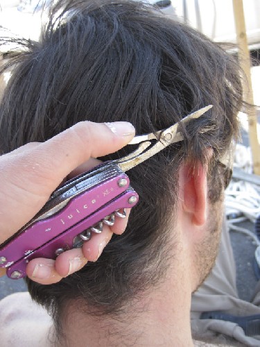 Jess cutting my hair with her Leatherman scissors
