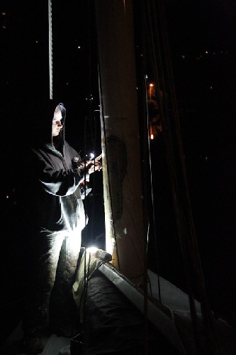 Jess working on the mast at night