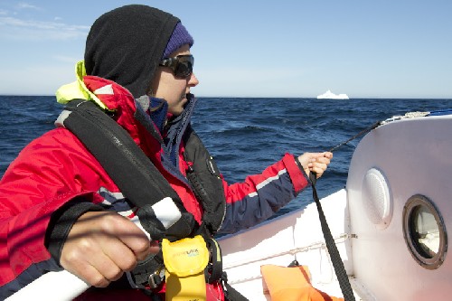 Jess sailing past an iceberg on the way out of St Anthony