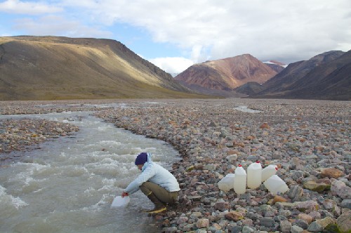 Filling up water from glacier river