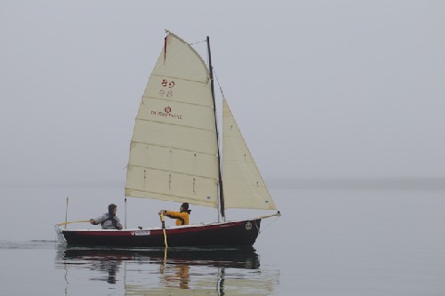 Chris and Brent sailing in his new little sailboat