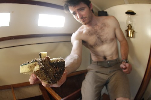 Chris cleaning out muck from the lockers