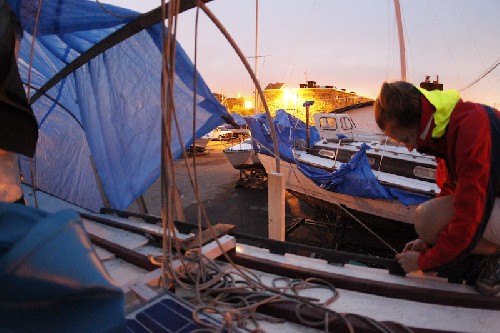 Jess setting up the first tarp for the cover