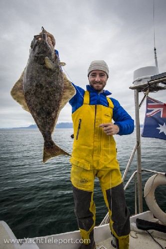 Chris holding up a hallibut
