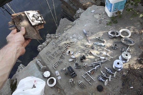 Opening our own chandelry shop - all our deck fittings we took off, some with bits of rotten hull attached. yikes.