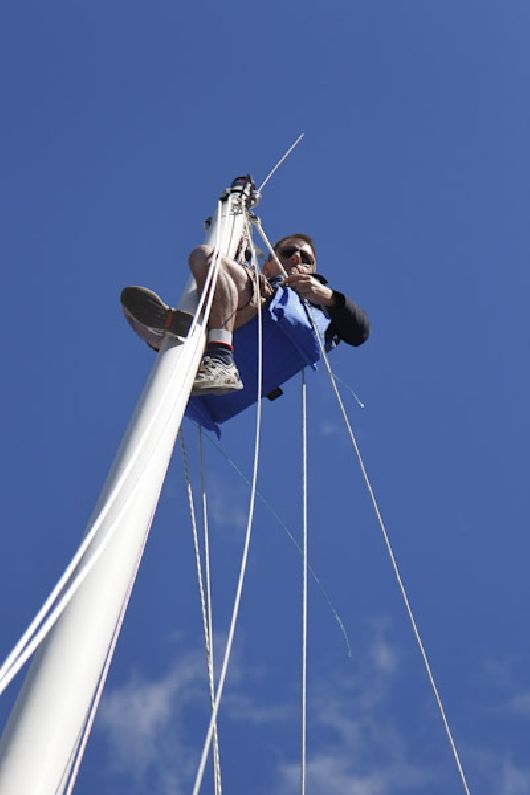Jim inspecting the top of Teleport's mast